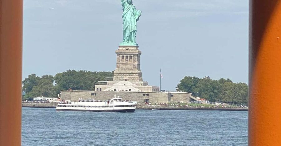 #1 Six Hour Bus Tour and Boat Ride By The Statue of Liberty - Theater District to Midtown icons, with frequent “see it, then move on” moments
