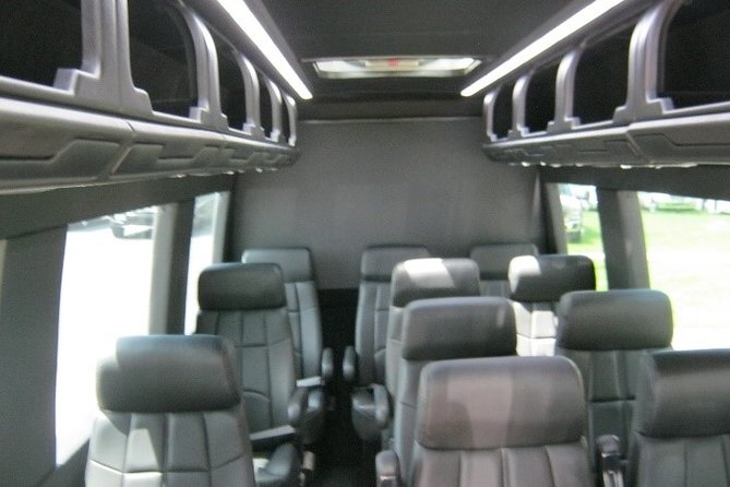 Affordable Door-To-Door Transport (NYC To Boston) - The van setup: reclining seats, tables, lamps, and AC
