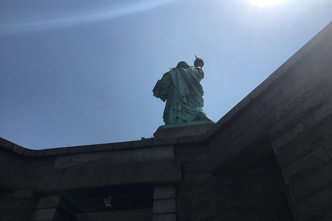 Ellis Island Statue of Liberty and 9/11 Memorial Pools Tour - Walking to Ground Zero: the workshop stop is mainly guided context