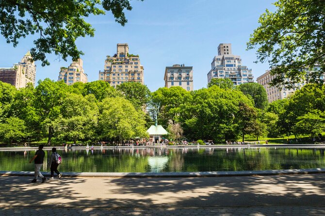 First Class Central Park Tour – Iconic Views & VIP Photo Moments - Rumsey Playfield, the Falconer, Daniel Webster, and Sheep Meadow wide-space payoff
