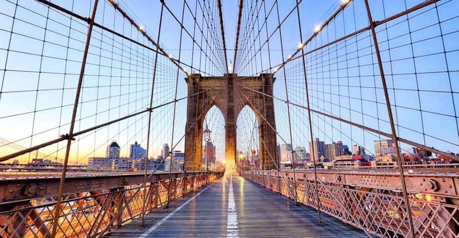 New York City: Brooklyn Bridge and Dumbo Walking Tour - Crossing the Brooklyn Bridge: construction secrets, photo angles, and that mysterious door