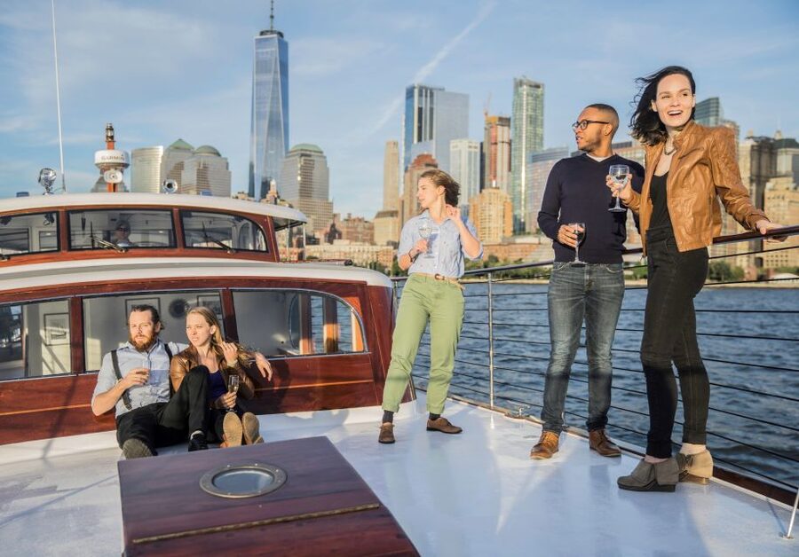 New York City: Mini Yacht Boat Ride with Sightseeing - Deck options: covered seating and an open bow for photos
