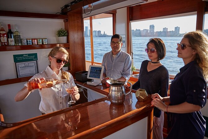 New York City Sunset Cocktail Cruise on Small Yacht - Empire State to One World Trade Center: the best skyline angles from water level