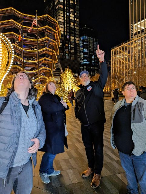 NYC: Holiday Lights Guided Bus Tour - Getting on at 770 7th Ave and riding in a glass-top bus