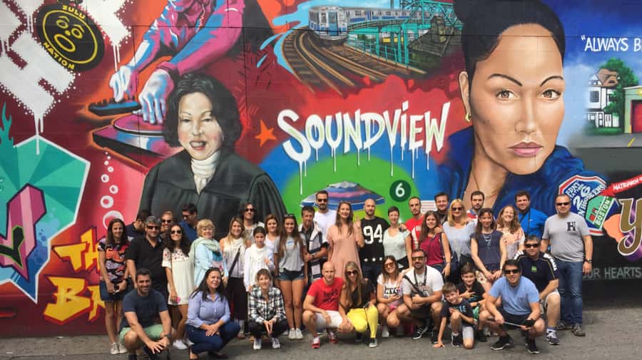 NYC: New York City Contrasts Tour through Harlem, The Bronx, Queens and Brooklyn - The Bronx: Joker stairs, Yankee Stadium, and murals with names