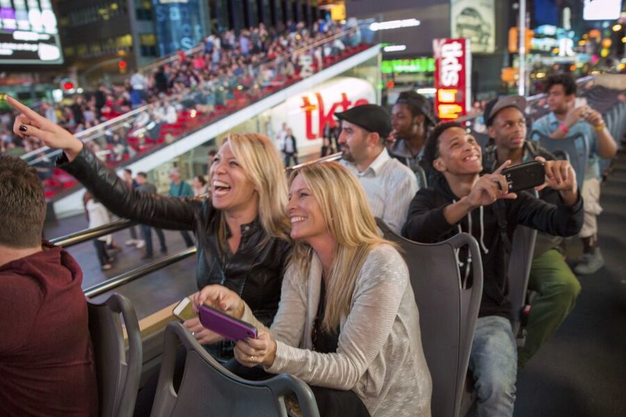 NYC: Sightseeing Night Tour by Open-Top Bus with Live Guide - Broadway, Lincoln Center, and the Theater District from the bus window