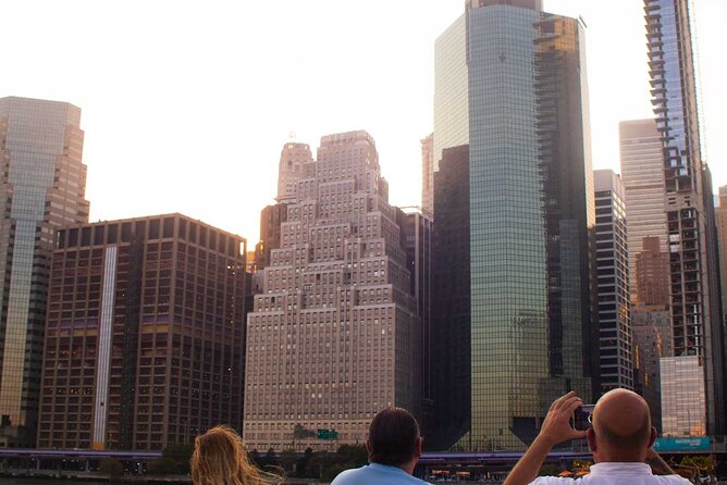 NYC Sunset Cruise Experience the City Twilight Magic - Battery Park Waterlines and One World Trade Center Switching On