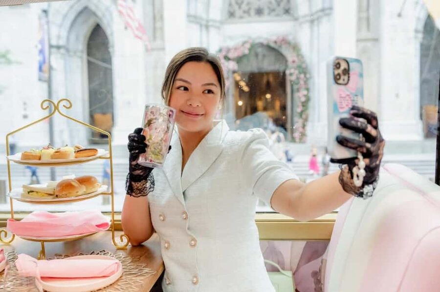 NYC: Tea Around Town Bus Tour with Live Entertainment - Boarding the pink teahouse bus: comfort first, then city views