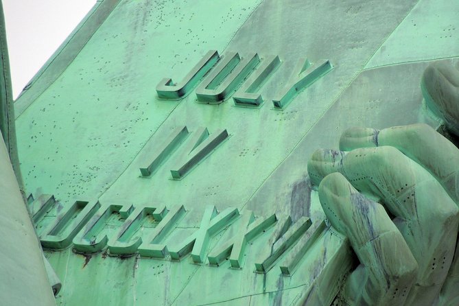 Statue of Liberty, Ellis Island, and 9/11 Memorial Guided Tour - A quick Wall Street loop: bull, NYSE, Federal Hall